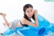 A young girl laying on an inflatable pool float.